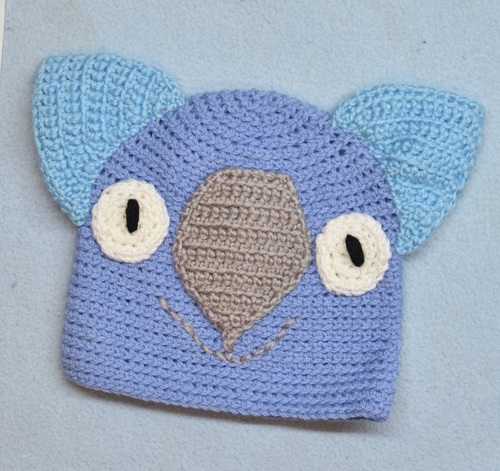 C 2 - 6. Wombat Beanie, hat  100% Wool Child 2 - 6 yrs   Blue, grey, sky