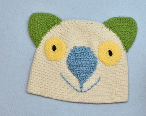 C 4 - 10. Wombat Beanie, hat  100% wool Child 4 - 10 yrs : Cream blue rose