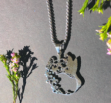 Load image into Gallery viewer, Humming Bird + blossom necklace Silver colour: Fun and Affordable. high quality Hypo allergic stainless steel.  Parts Made in China No shipping to US due to tarrifs