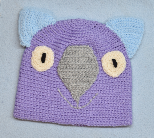 C 2 - 6. Wombat Beanie, hat  100% Wool Child 2 - 6 yrs   Purple grey sky