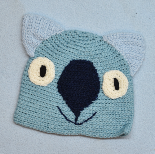 C 2 - 6. Wombat Beanie, hat  100% Wool Child 2 - 6 yrs  Teal, black soft blue