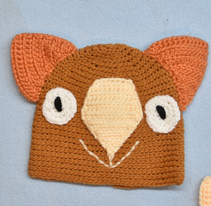 C 1 - 2. Wombat Beanie, hat  100% Wool Child 1 - 2 yrs   Pumkin Cream, orange