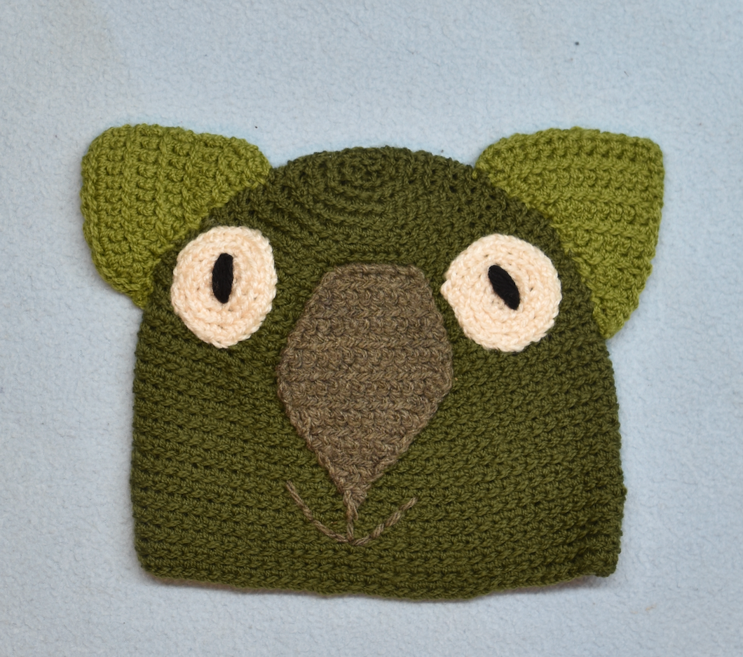 C 1-2. Wombat Beanie, hat  100% Wool Child: 1 - 2   yrs  Dark sage coffee