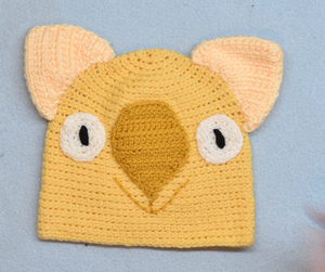 C 2 - 6. Wombat Beanie, hat  100% Wool Child 2 - 6 yrs   Yellow rust cream