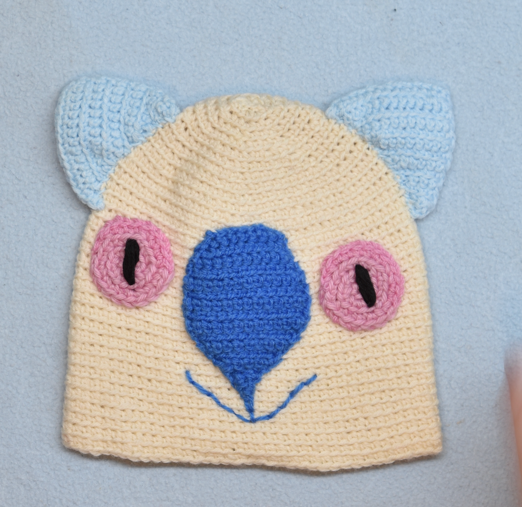 C 2 - 6. Wombat Beanie, hat  100% Wool Child 2 - 6 yrs Cream royal sky