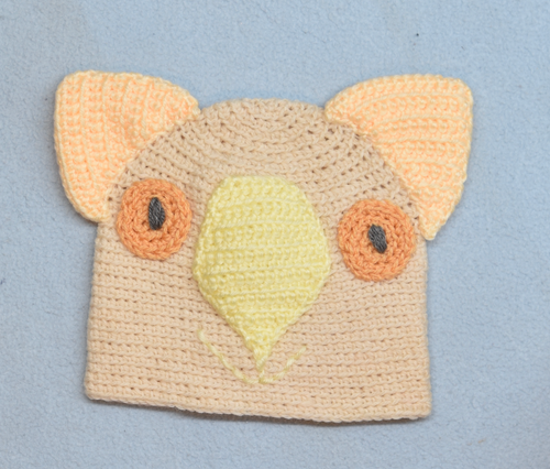 C 2 - 6. Wombat Beanie, hat  100% Wool Child 2 - 6 yrs Cream lemon cream