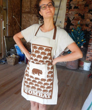 Load image into Gallery viewer, Wombat Apron natural colour with pocket brown print wombat